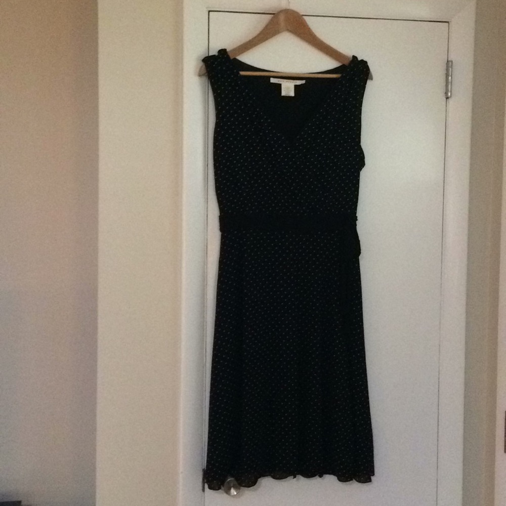 Sleeveless fully lined black polka dot dress